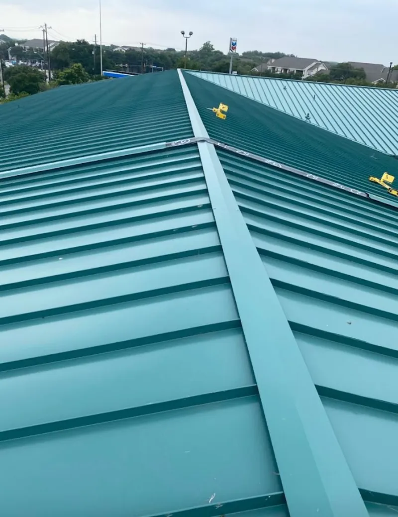 Green commercial metal roof ridge and valley for Metal Roof Repair in Fairfield Plantation